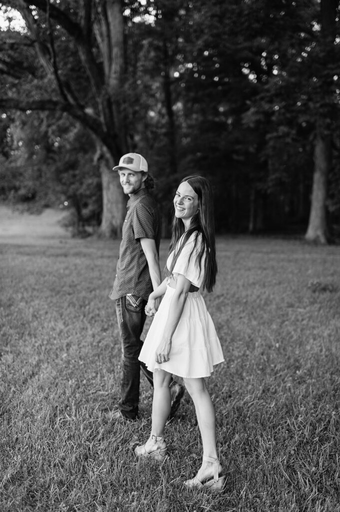 Black and white photo of a couple walking outdoors