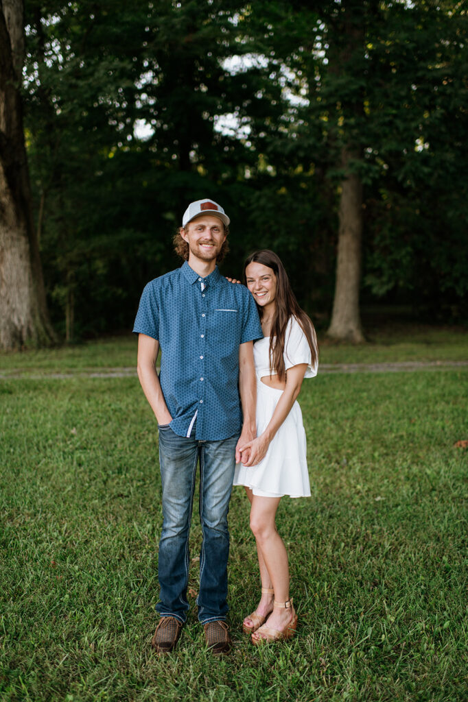 Couple posing together outside