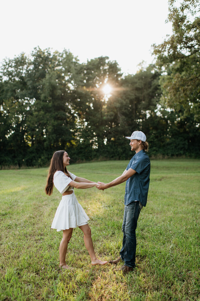 Man and woman holding hands during their Midwest engagement shoot in Indiana