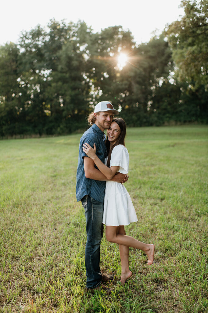 Man and woman laughing during their Midwest engagement photos in Albion, Indiana