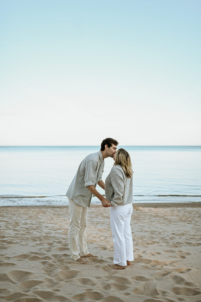 Man and woman kissing after their Michigan surprise proposal