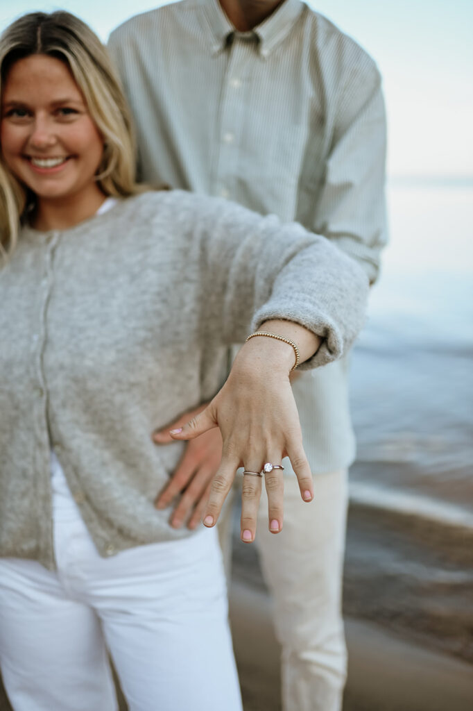 Woman showing off her ring after their surprise proposal in New Buffalo, Michigan