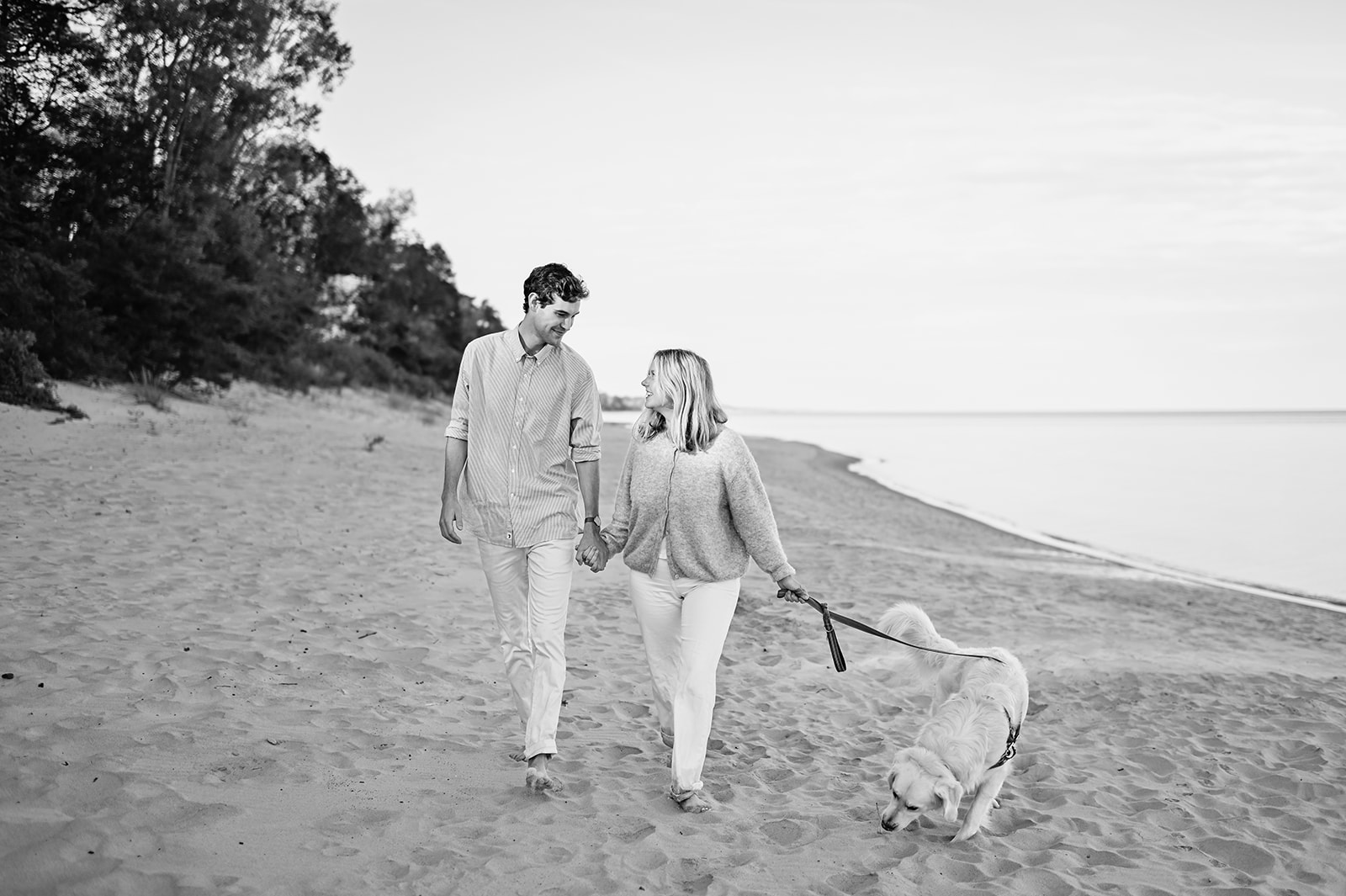 Black and white New Buffalo Michigan beach engagement photo