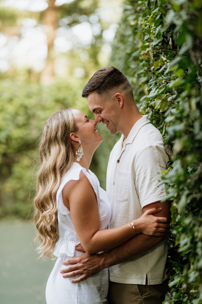 Couple touching noses as they pose for their Indiana engagement session