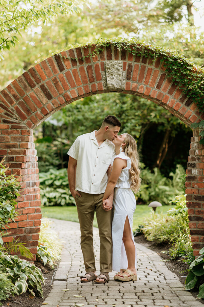 Couple kissing during their Hamstra Gardens engagement photos in Wheatfield, Indiana