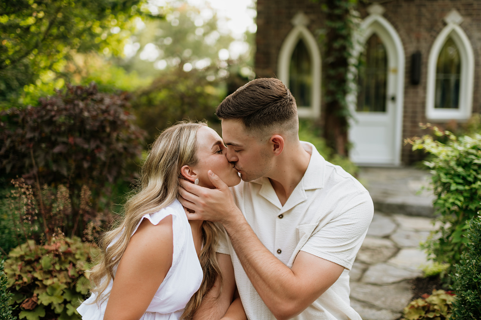 Couple kissing at Hamstra Gardens in Wheatfield, Indiana