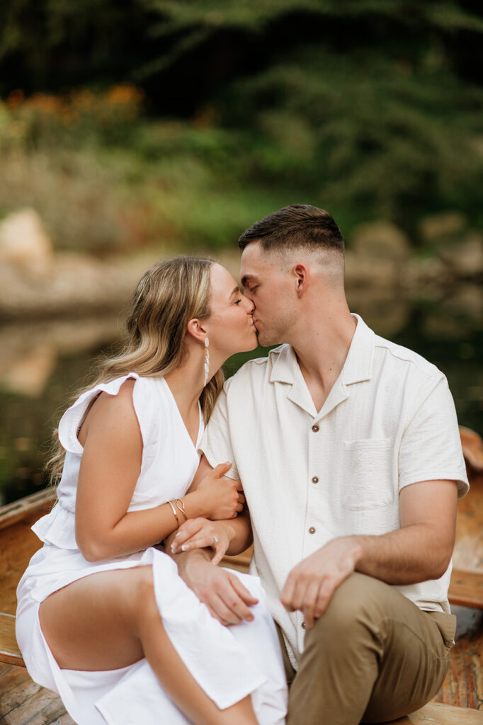 Couple kissing in a canoe