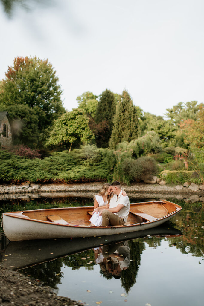 Couple holding each other as they sit in a canoe