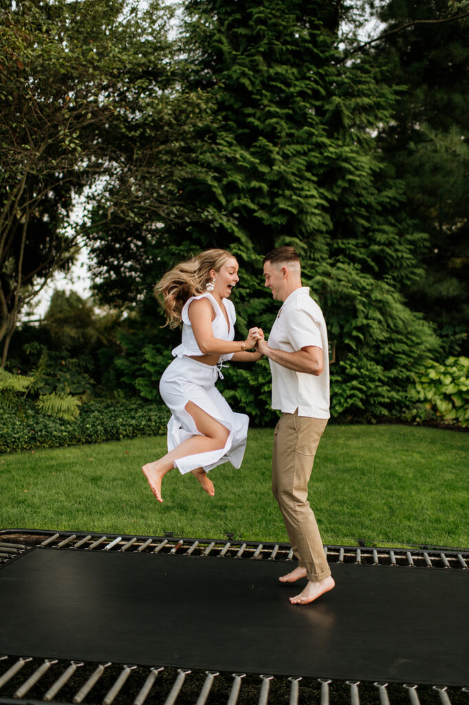 Man and woman jumping on a trampoline at Hamstra Gardens in Wheatfield, Indiana