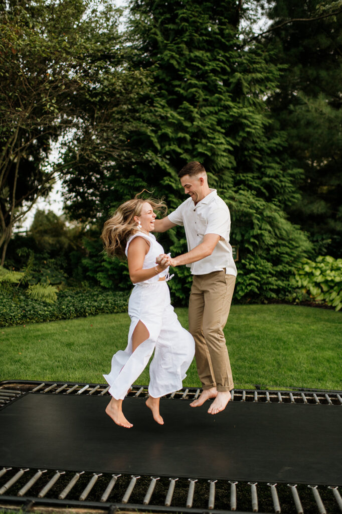 Man and woman jumping on a trampoline at Hamstra Gardens in Wheatfield, Indiana