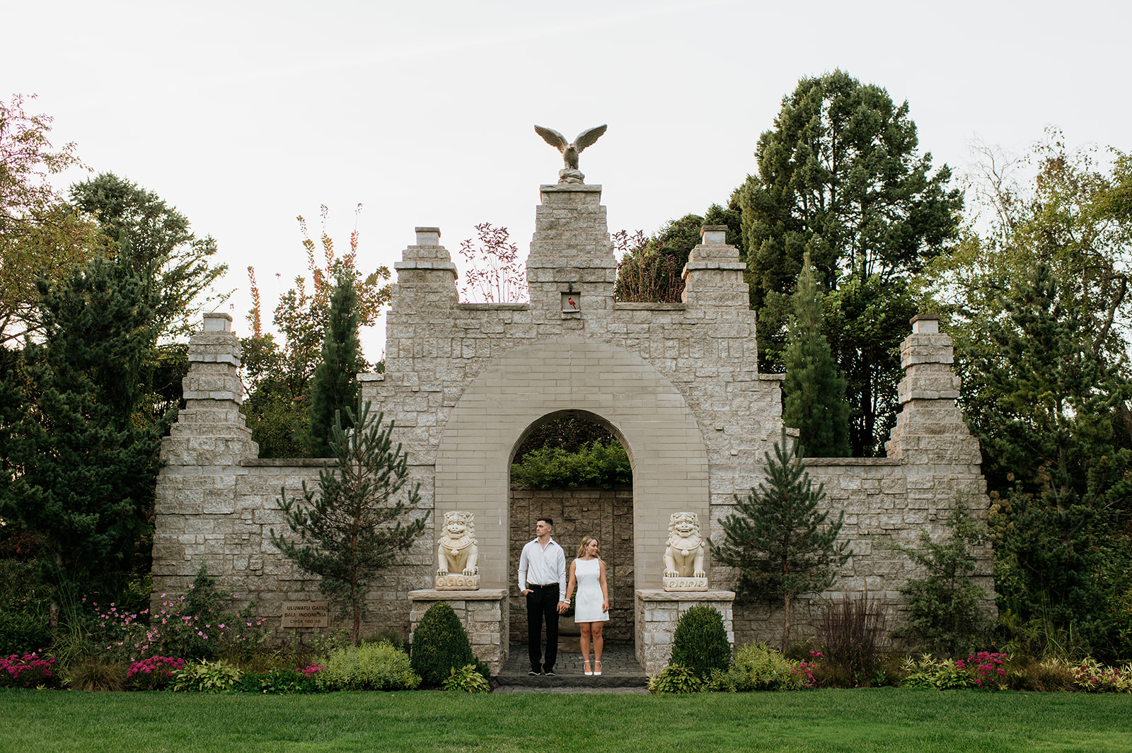 Couple posing for their engagement session at Hamstra Gardens in Wheatfield, Indiana