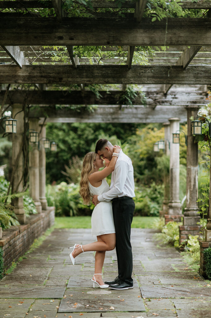 Couple posing for their Hamstra Gardens engagement photos in Wheatfield, Indiana