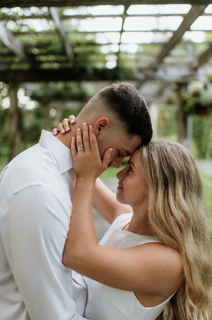 Couple holding each other during their Hamstra Gardens engagement session in Wheatfield, Indiana