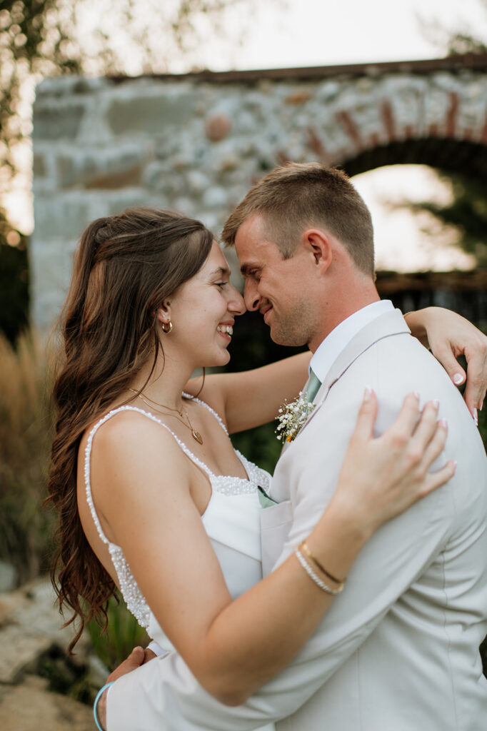 Close up shot of a bride and groom touching noses