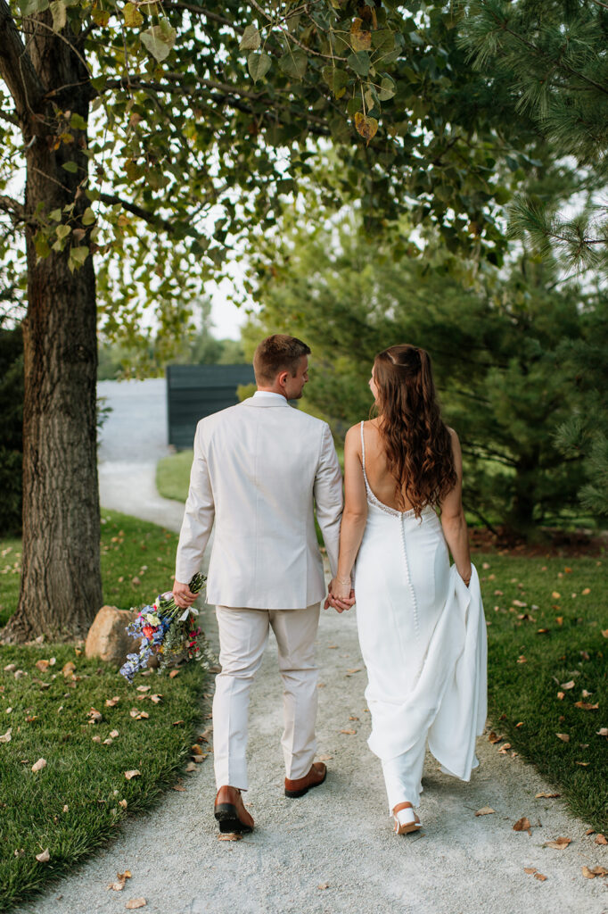 Bride and groom walking a pathway