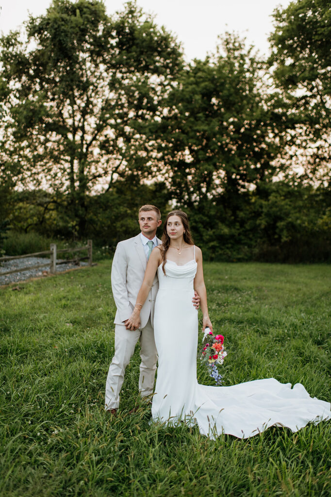 Outdoor bride and grooms portraits in an open field