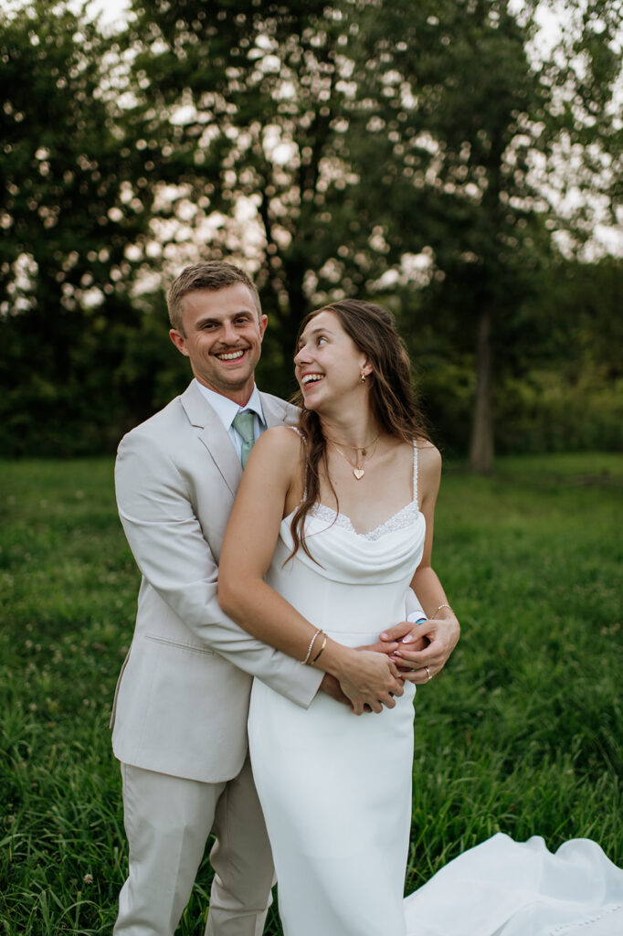 Outdoor bride and grooms portraits in an open field