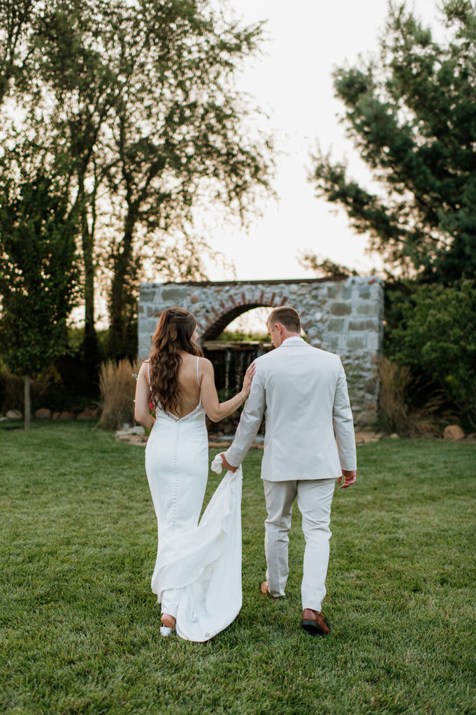 Bride and groom walking outside