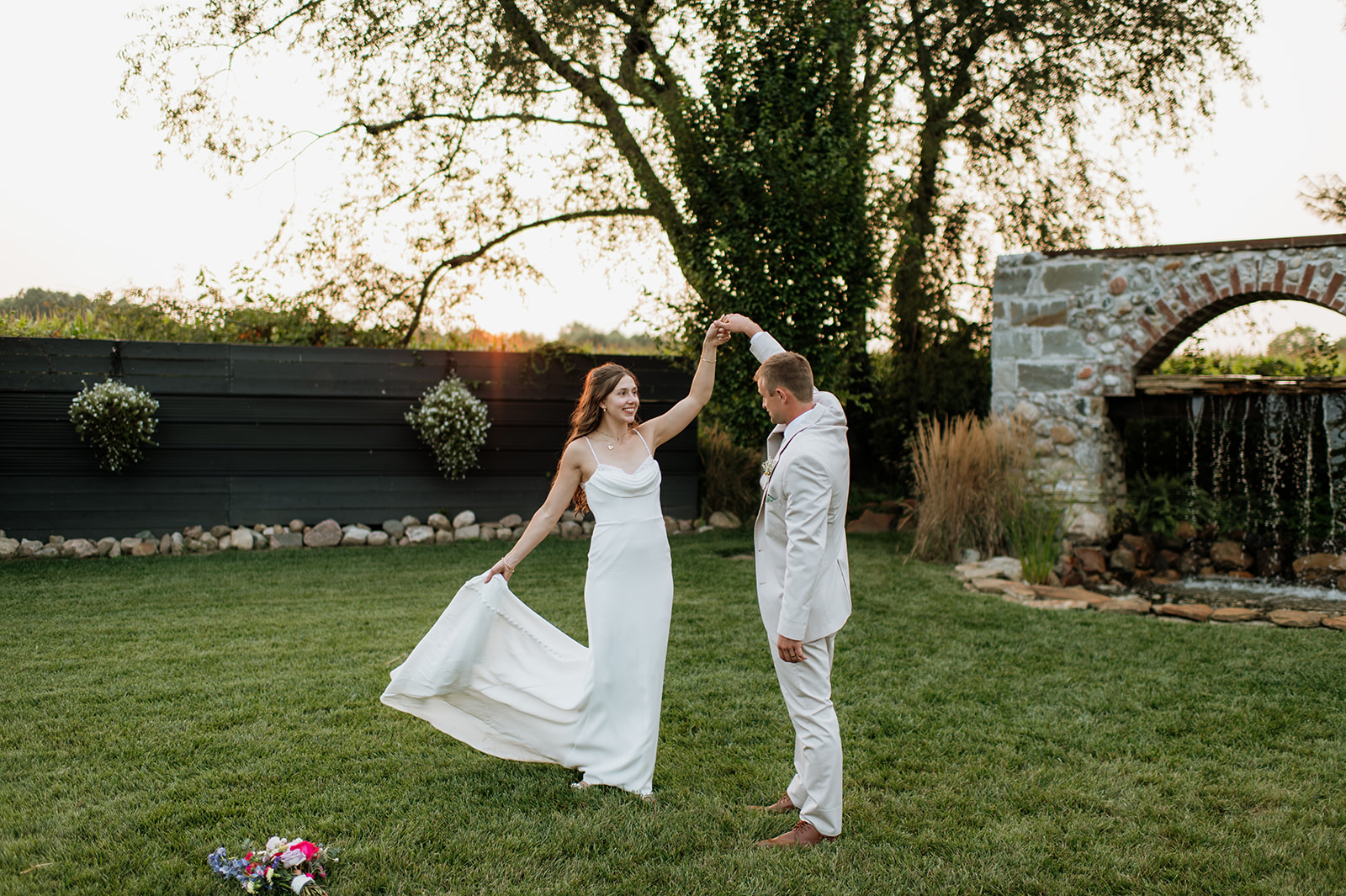 Bride and groom posing at sunset at Empeiria 110 wedding venue in Rochester, Indiana