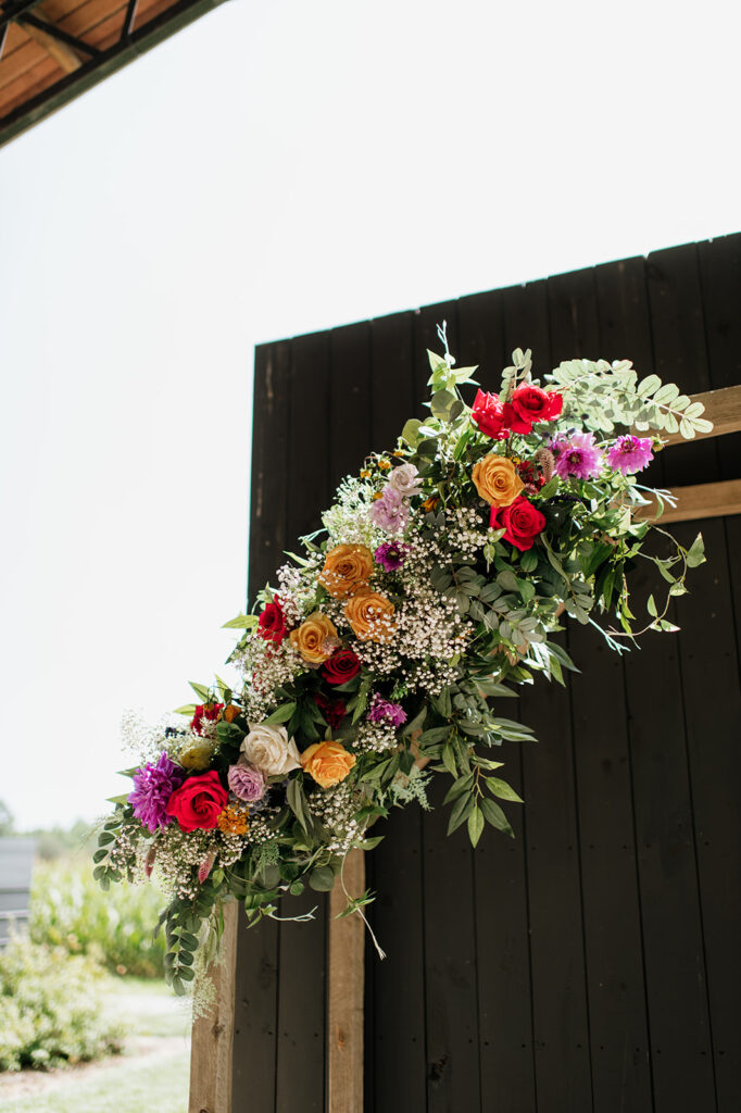 An outdoor Empeiria 110 wedding ceremony underneath the pavilion 