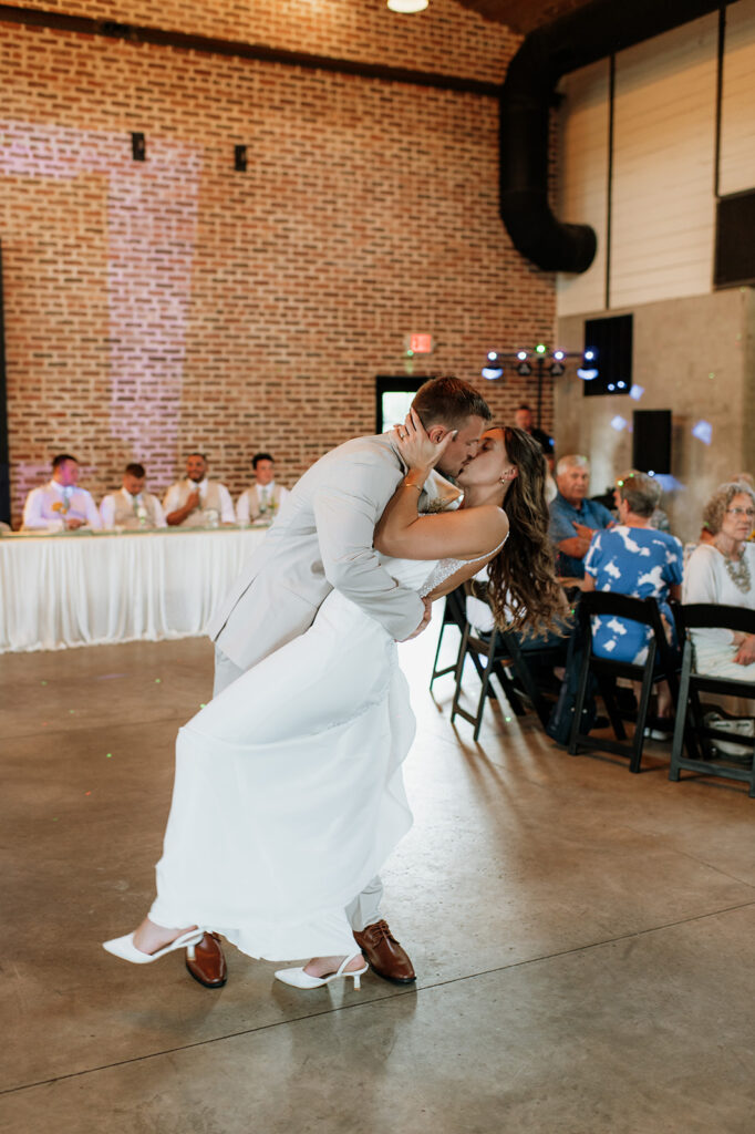 Bride and groom kissing after their first dance