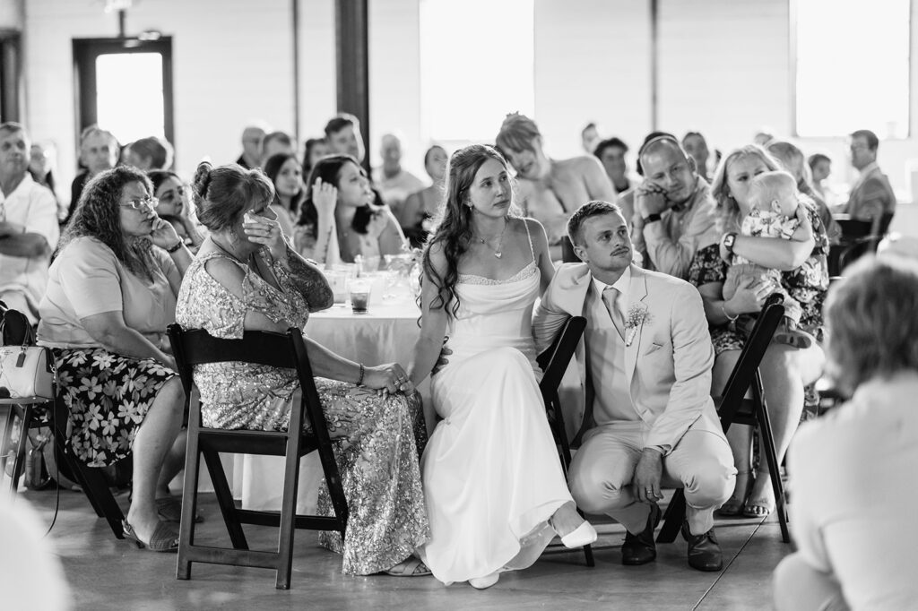 Wedding guests watching a slideshow