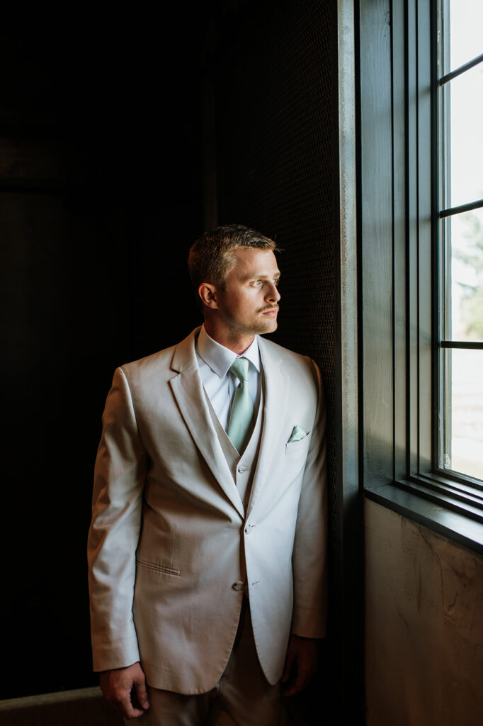 Indoor grooms portraits at Empeiria 11o wedding venue in Rochester, IN