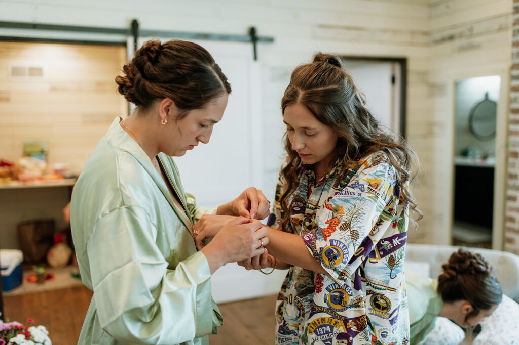 Bride getting jewelry put on