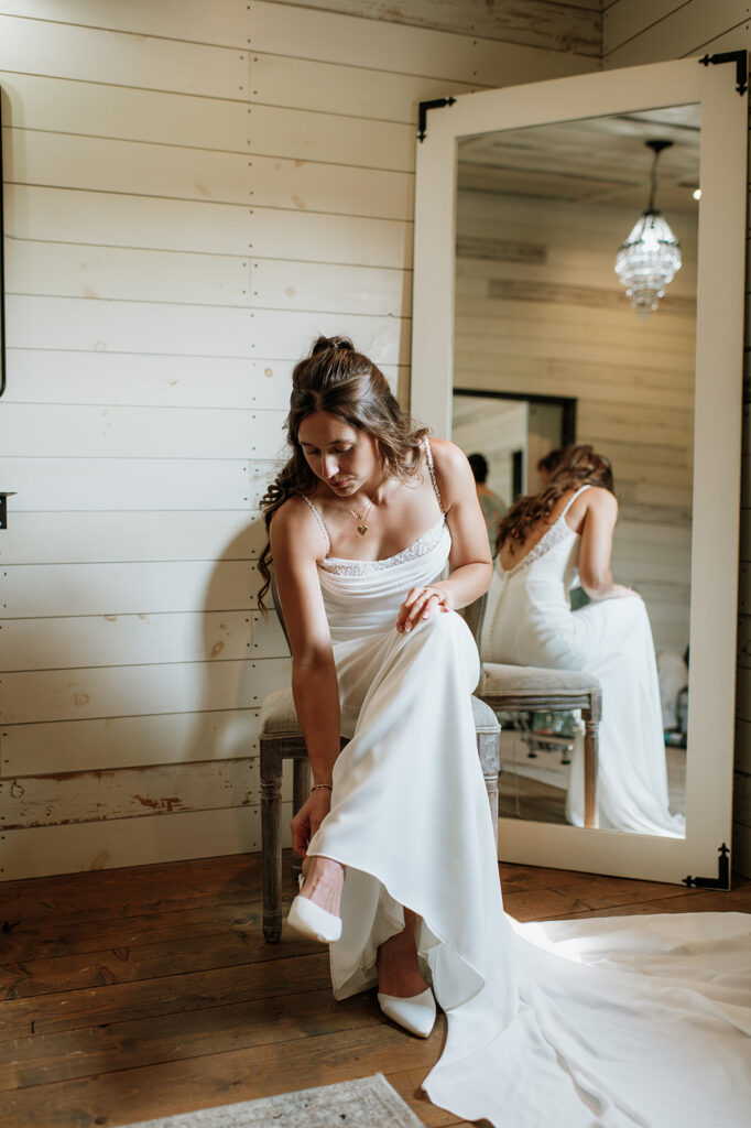 Bride putting her heels on 