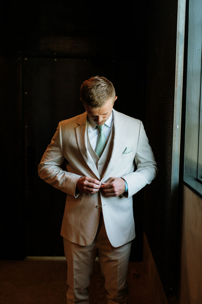 Indoor grooms portraits at Empeiria 11o wedding venue in Rochester, IN