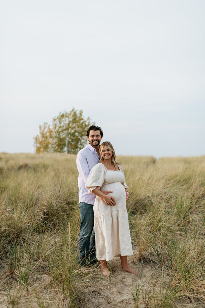 Couple posing in the beach grass at New Buffalo Beach 