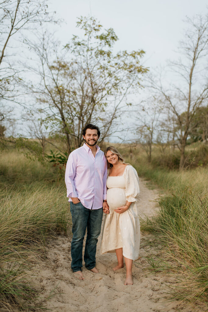 Couple posing at New Buffalo Beach in MI