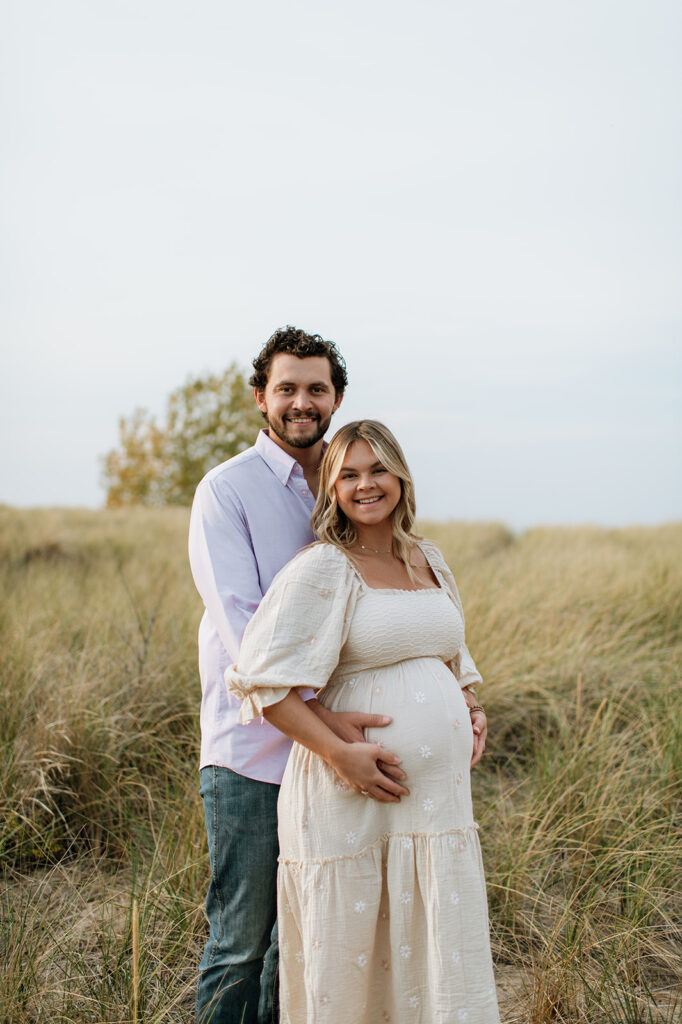 Couple posing in the beach grass at New Buffalo Beach 