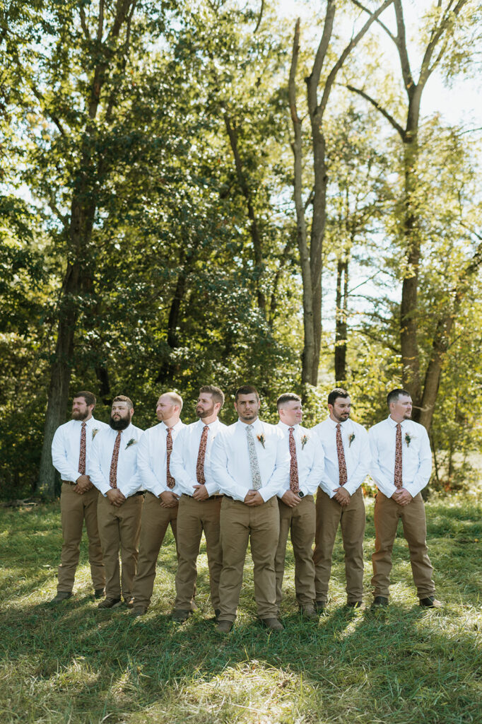 Outdoor groom and groomsmen portraits from a fall backyard wedding in Culver, Indiana