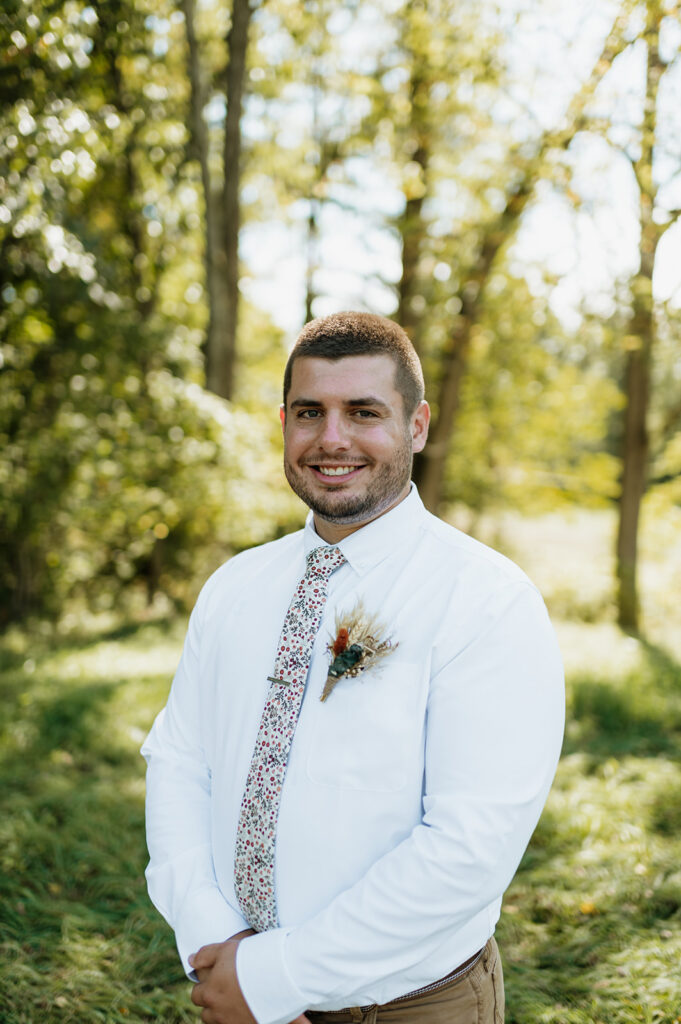 Outdoor grooms portraits from a fall backyard wedding in Culver, Indiana