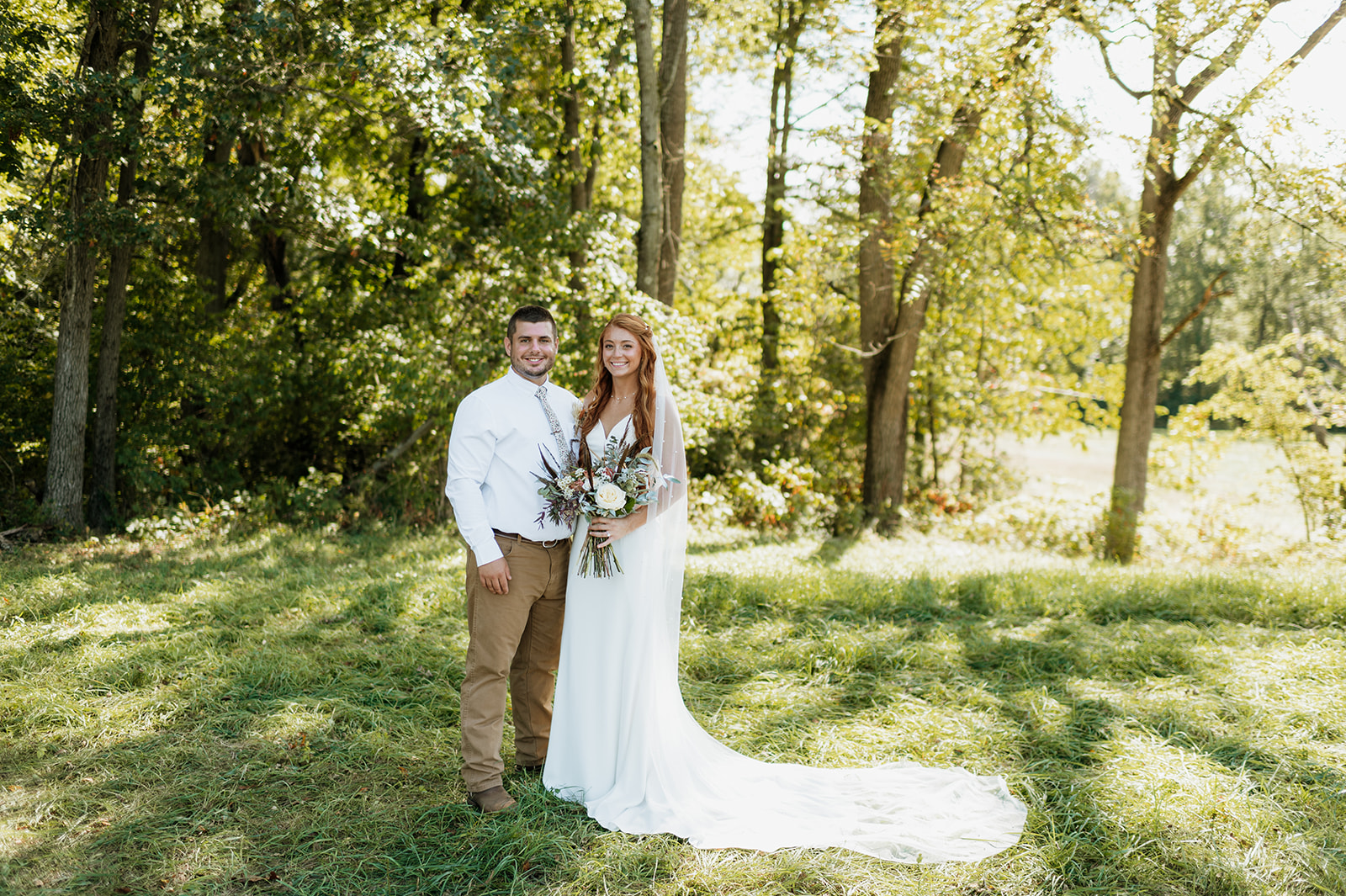 Bride and grooms outdoor fall backyard wedding portraits in Culver, Indiana