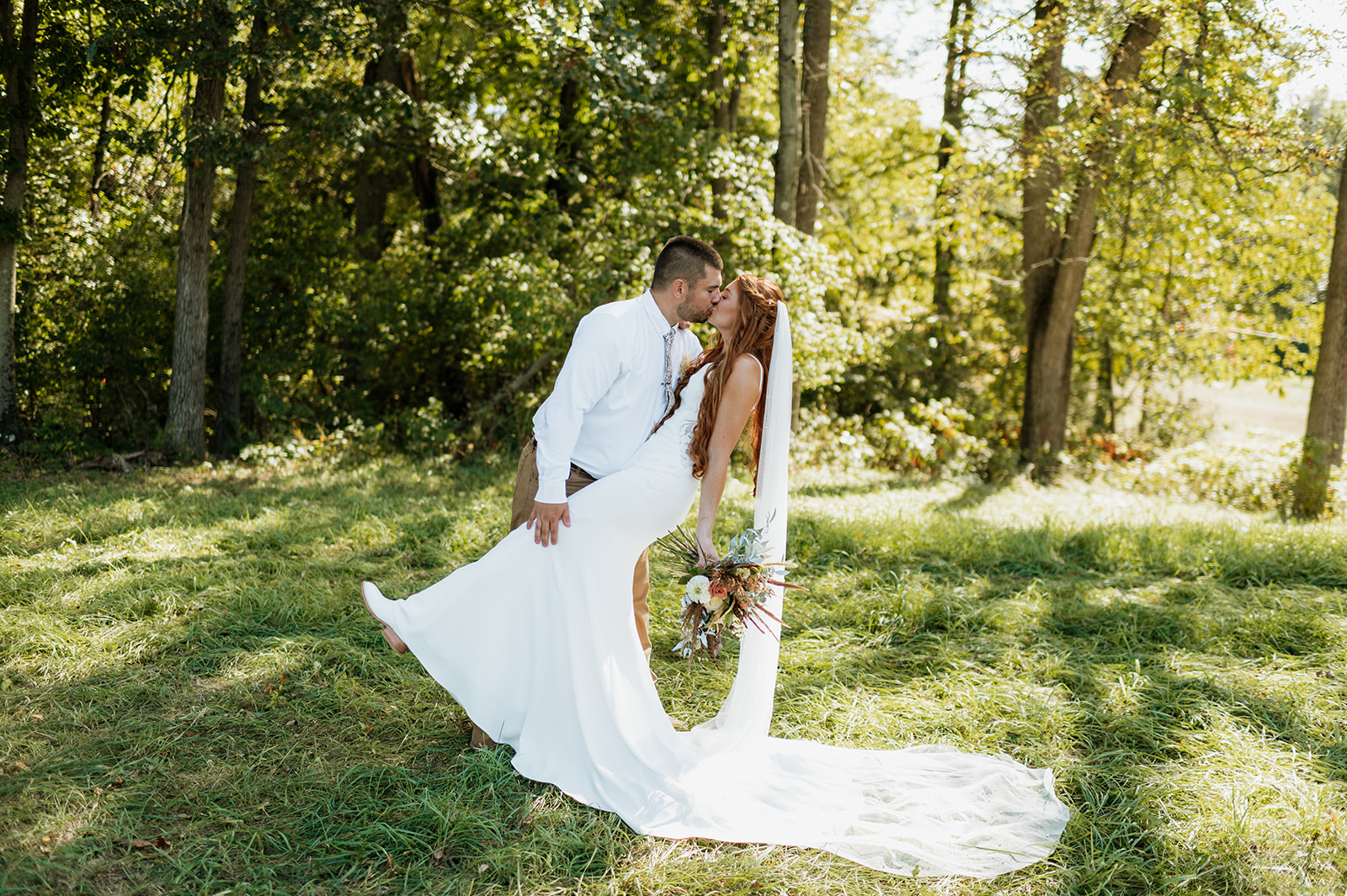 Outdoor bride and grooms portraits from a fall backyard wedding in Culver, Indiana