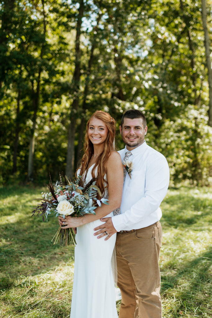 Outdoor bride and grooms portraits from a fall backyard wedding in Culver, Indiana