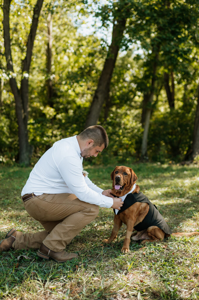 Outdoor grooms portraits with his dog