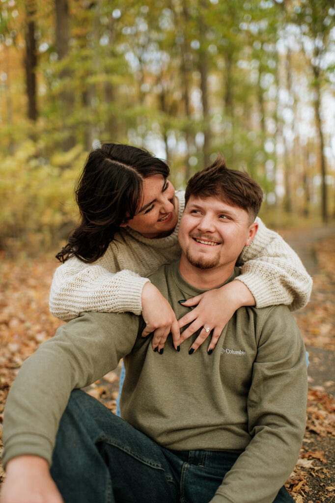 Couple posing during their fall Northern Indiana engagement photos in Potatoe Creek State Park