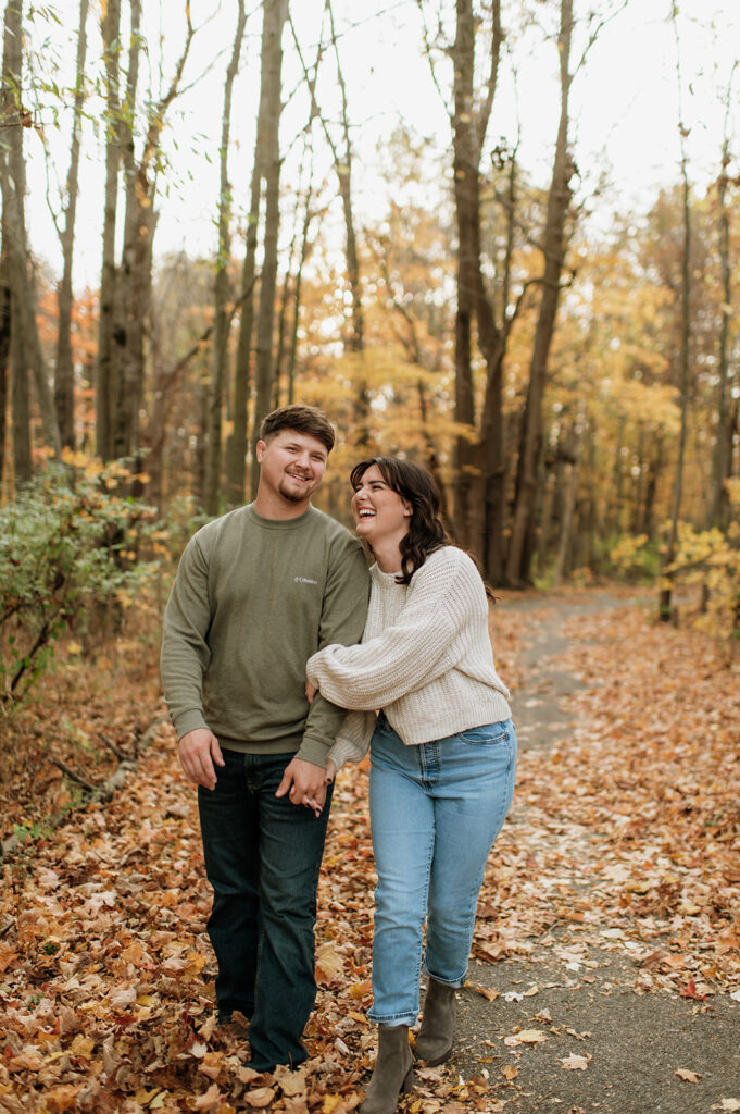 Couples walking through Potato Creek State Park for their Northern Indiana engagement photos