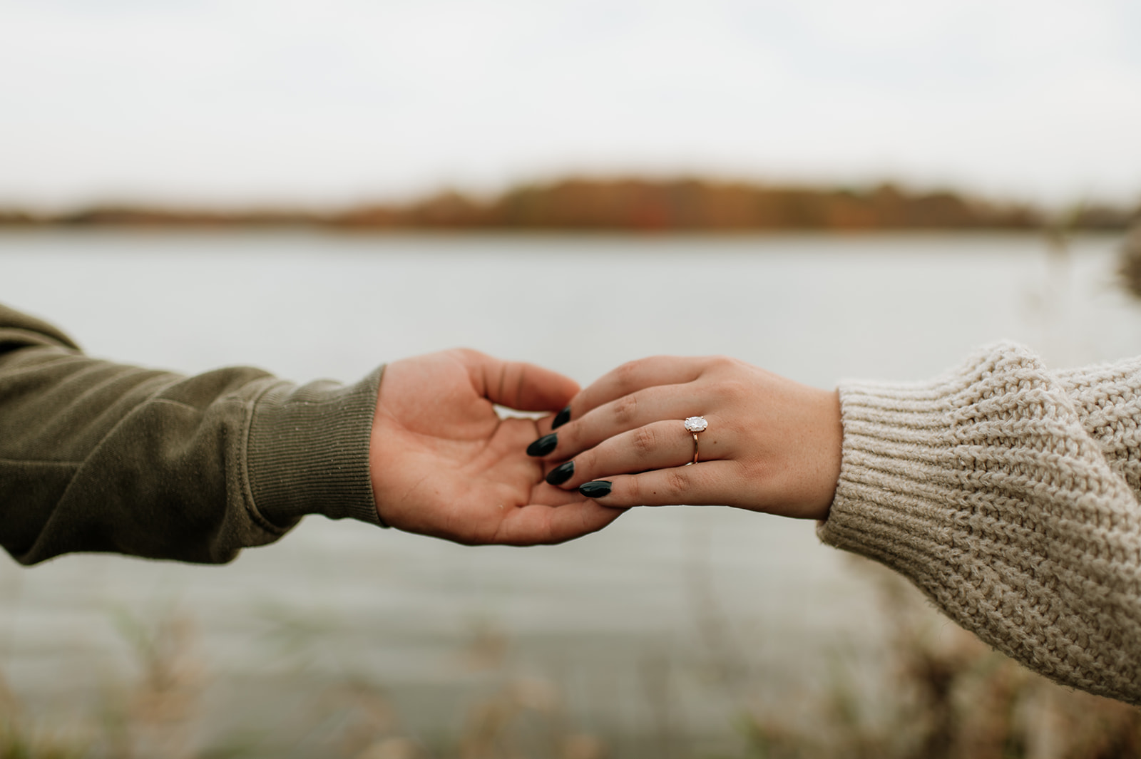 Couple holding hands during their Northern Indiana engagement photos at Potato Creek State Park