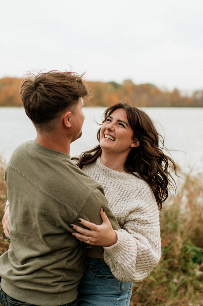 Couple posing in front of Worster Lake at Potato Creek State Park