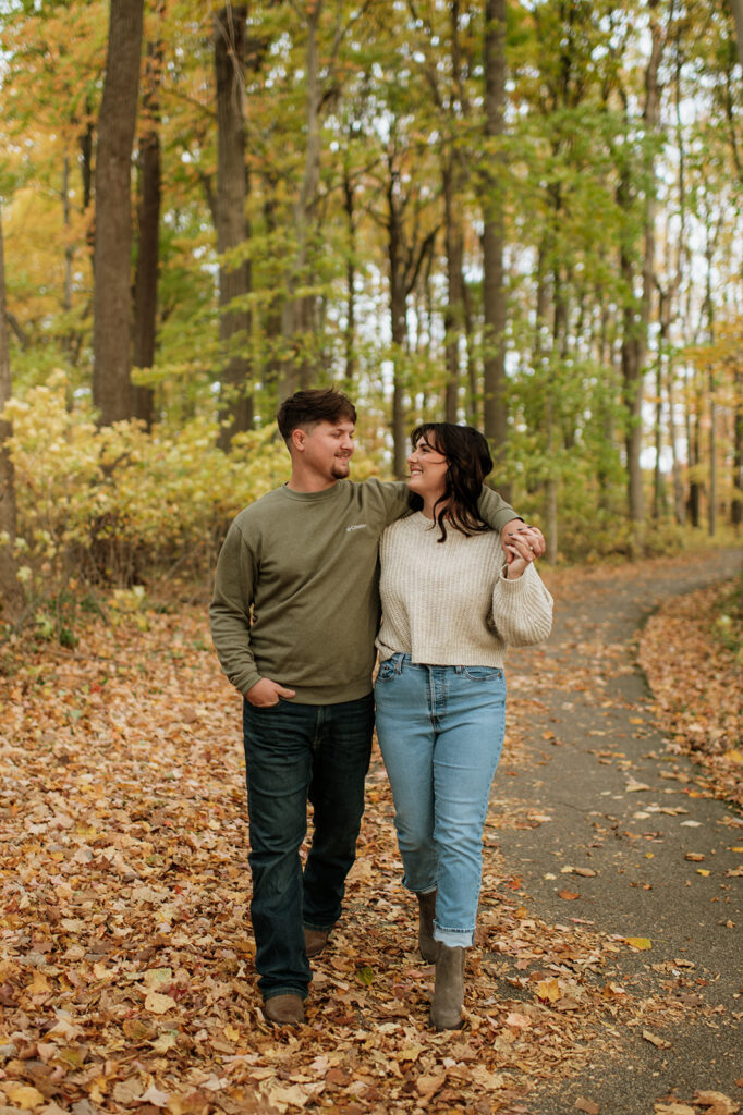 Couple walking the trails at Potato Creek State Park for their Northern Indiana engagement photos