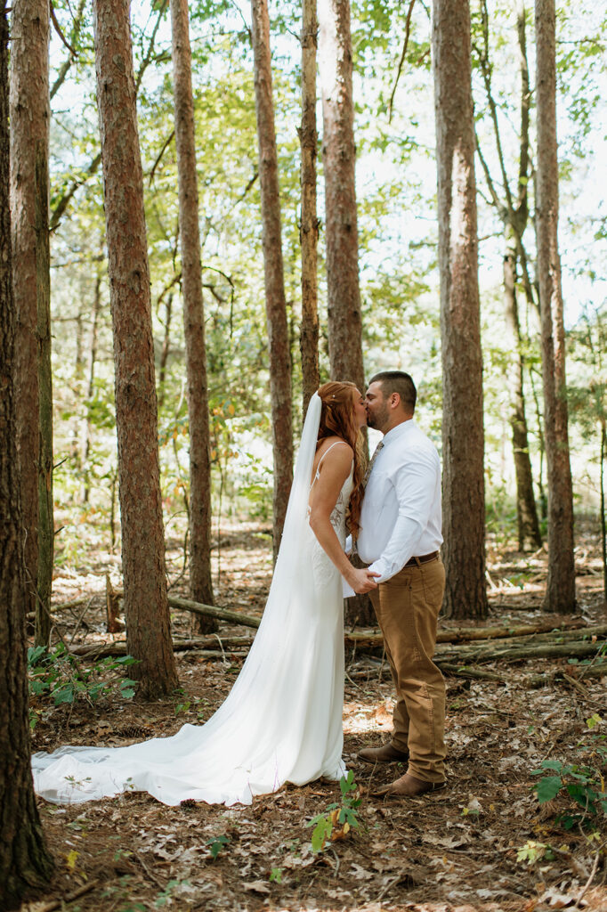 Bride and groom kissing after exchanging private vows