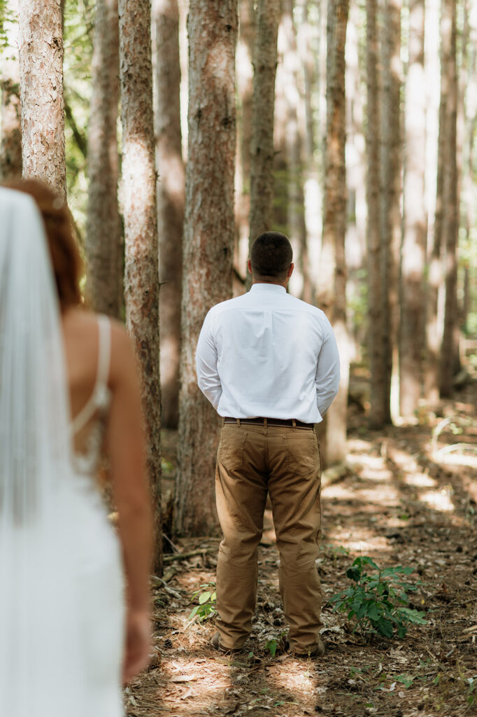 Bride and groom about to share a first look for their fall backyard wedding in Culver, Indiana