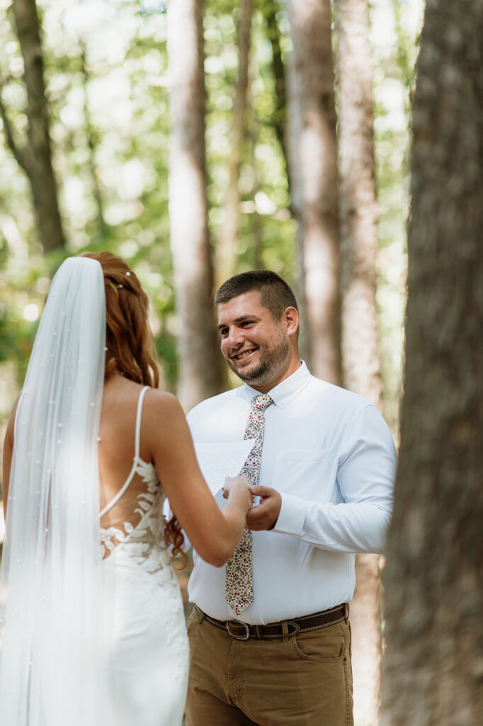 Bride and groom sharing private vows after their first look