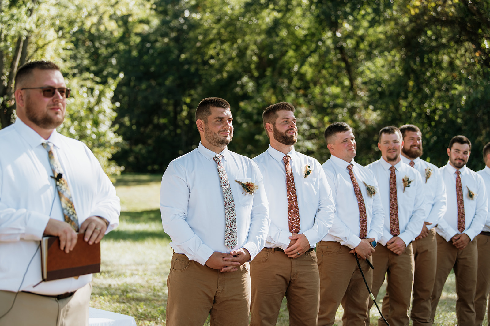 Groom watching his bride walk down the aisle