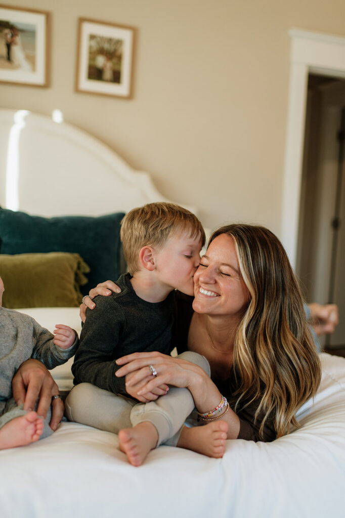  Little boy kissing his mom on the cheek