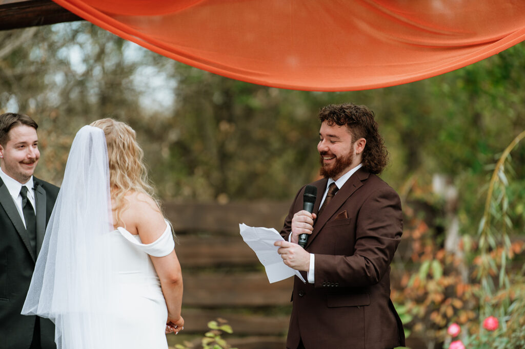 Groom reading his vows to the bride